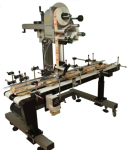 Novexx Top Labeler This labeling system will apply a label on the top of your product, such as lids on tins or small caps.
